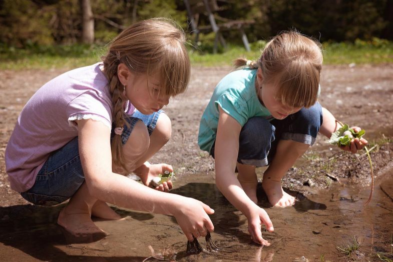Restoring Habitat - girls finding frog eggs